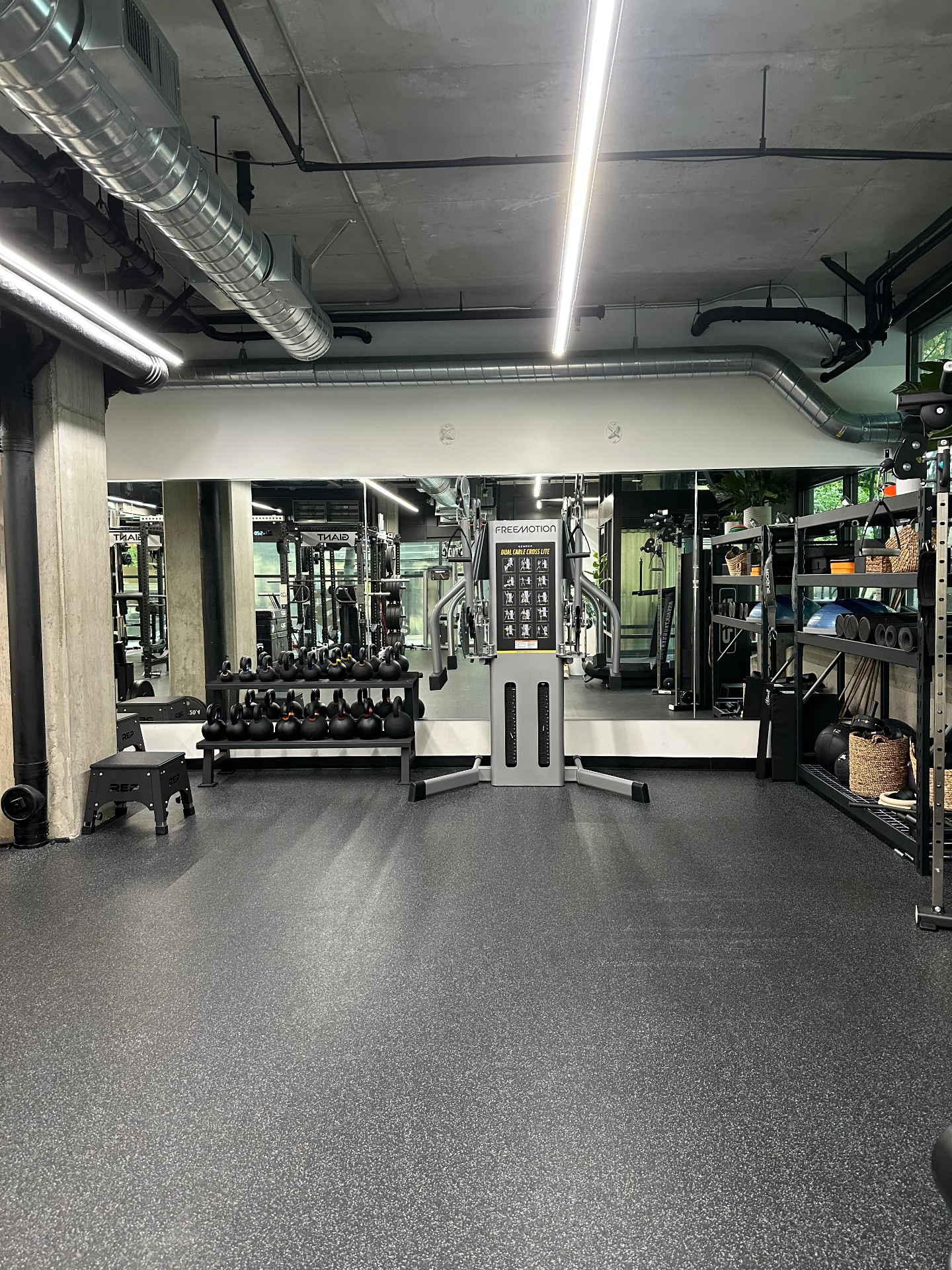 Cable station and kettlebell area inside the gym